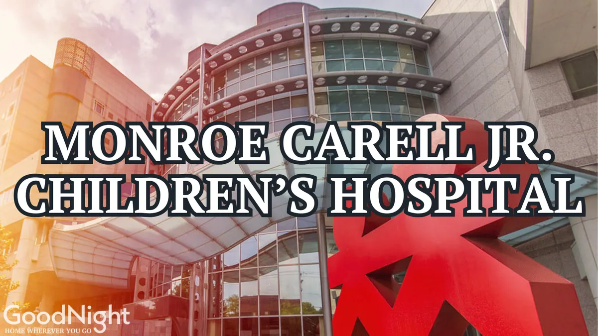 The modern facade of Vanderbilt Children’s Hospital, complete with a striking red sculpture and a welcoming entrance area. The setting is clean, safe, and reassuring—evoking peace of mind for parents.