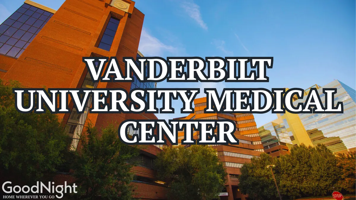 This photo presents the Vanderbilt University Medical Center building, surrounded by greenery with the city skyline in the distance. The composition highlights easy proximity to major institutions and offers a sense of the urban context, with both tranquility and accessibility.